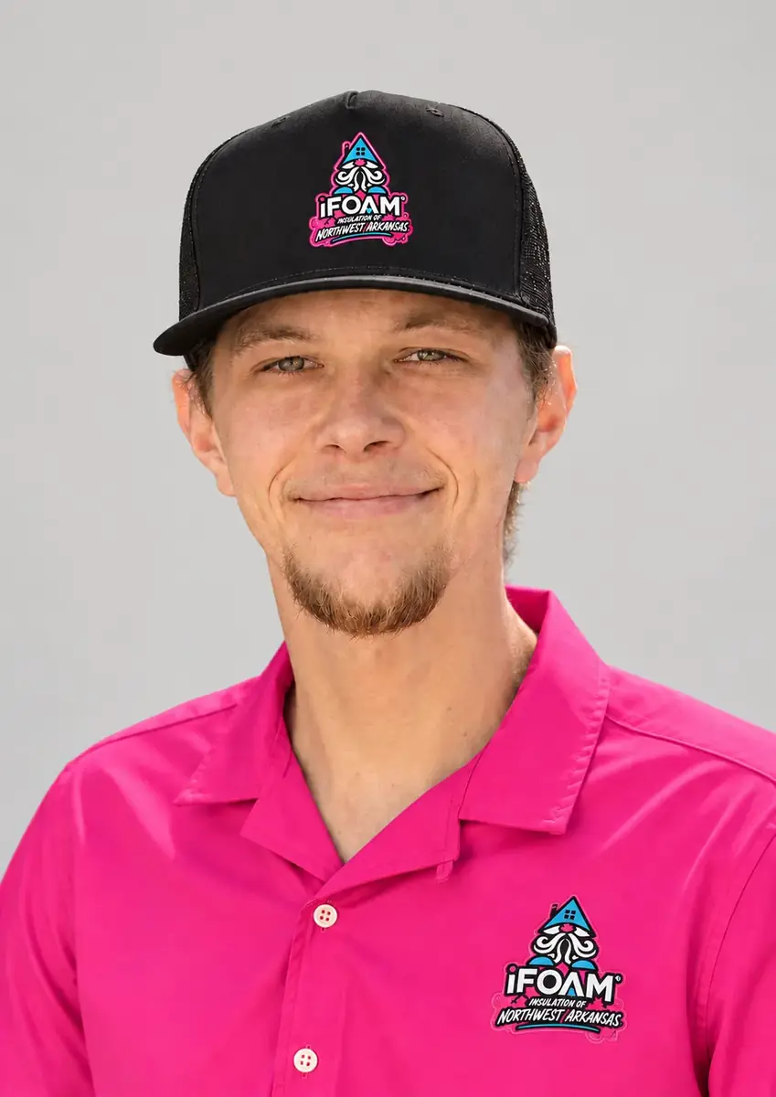 An iFOAM Insulation of Northwest Arkansas installer in branded uniform