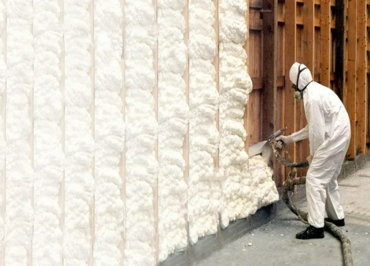 Closed-cell spray foam applied between wall studs